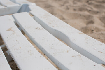white sun loungers on the sandy beach