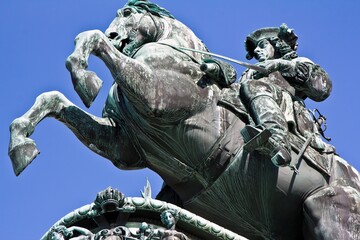 Fototapeta premium Closeup veiw of the statue of Prince Eugene of Savoy against the blue sky at Heldenplatz (German: Heroes' Square), a public space in front of the Hofburg Palace in Vienna, Austria.