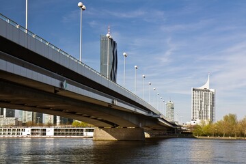 VIENNA, AUSTRIA - APRIL 15, 2015: The Imperial bridge (Reichsbrucke) across Danube river with the...