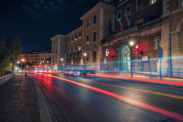Long exposure photography of night traffic in the city of Rome Italy