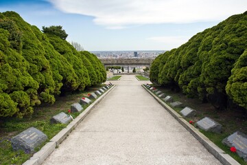 BRATISLAVA, SLOVAKIA - APRIL 21, 2015. Walking path with graves at the both sides of it of Soviet Army soldiers who fell during World War II.  .