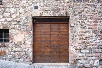 Old Wooden Door on Grunge Brick Wall