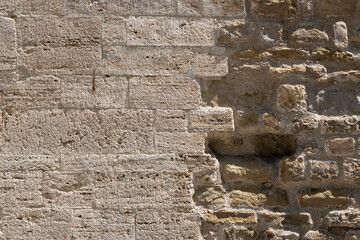 Old weathered brick wall fragment