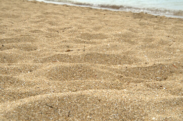 Primo piano alla calda e soffice spiaggia del mare.