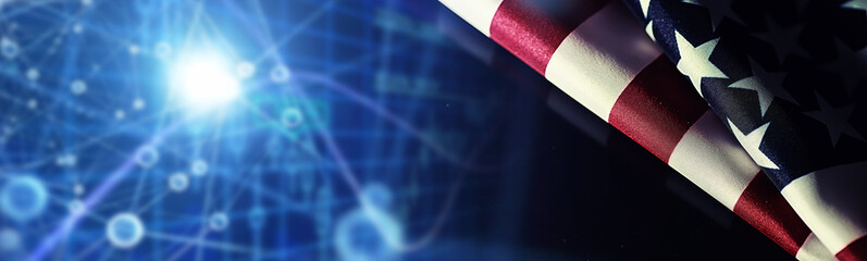 American flag and rose flower on the table. Symbol of the United States of America and red petals. Patriotism and memory.