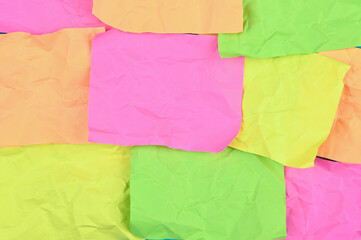 Multi-colored crumpled sheets of paper.