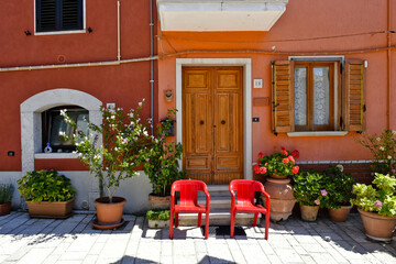 A narrow street among the old houses of Santa Croce del Sannio, a rural village in the Campania region.