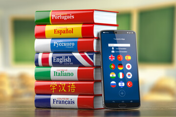 Mobile dictionary, translator  and e-learning.concept . Learning languages online.  Smartphone and books with language courses.
