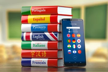 Fotobehang Mobile dictionary, translator  and e-learning.concept . Learning languages online.  Smartphone and books with language courses. © Maksym Yemelyanov