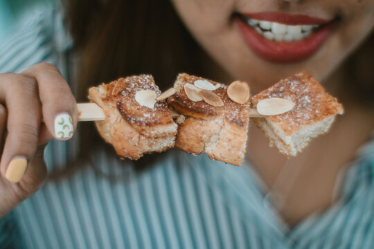 Woman Holding A Bread Toast