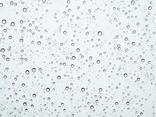 Closeup raindrops on glass car in the rainy season.