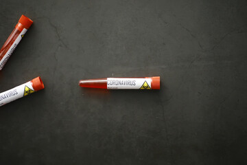 A blood sample for testing the dangerous virus coronavirus in the body. Test tubes with tests for coronavirus. Laboratory studies of viral diseases.