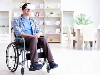 Disabled man studying with virtual reality glasses