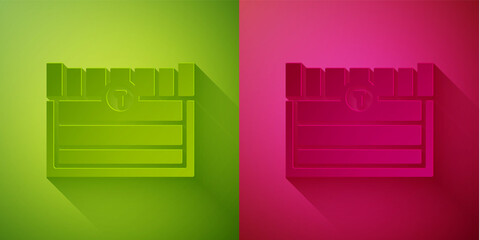Paper cut Antique treasure chest icon isolated on green and pink background. Vintage wooden chest with golden coin. Paper art style. Vector.