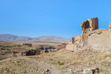 Fototapeta na wymiar Ruins of walls & buildings of medieval city Ani, near Kars, Turkey. City founded in 5 century by Armenians. After series of conquests & earthquake it was abandoned. It's UNESCO object