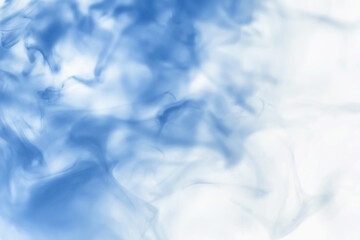 Puffs of paint in water. The dissolution of the dye in water. Water pollution. Concept art creativity.