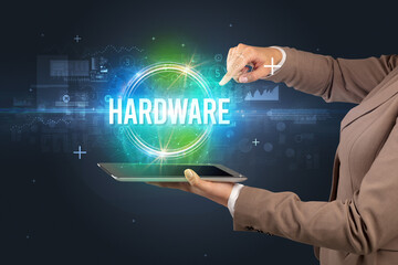 Close-up of a touchscreen with HARDWARE inscription, new technology concept