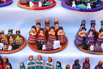 Christmas figurines in a traditional mayan textiles for sale, Antigua Guatemala