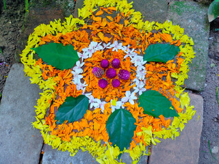 onam festival flower mat made using flowers and leaves