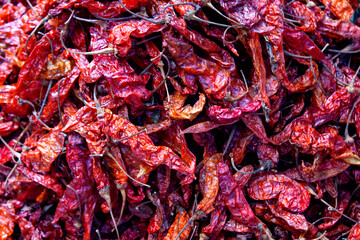 Pile of dried and smoked red hot peppers for sale, horizontal, Antigua Guatemala