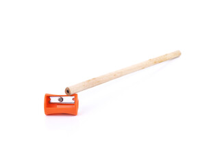 Pencil with sharpening shavings on white background