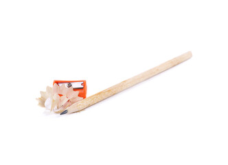 Pencil with sharpening shavings on white background