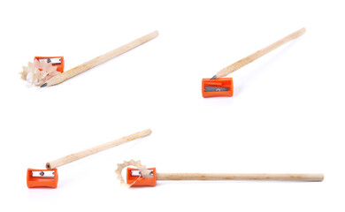 Pencil with sharpening shavings on white background