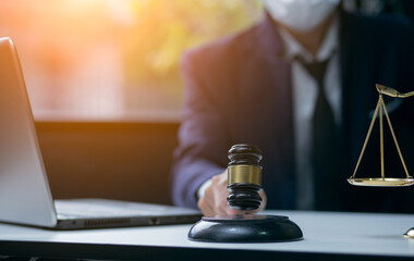 Male lawyer or judge wearing protective mask on the consult having team meeting with client, Law and Legal services concept