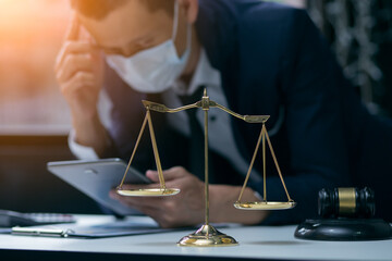 Male lawyer or judge wearing  protective mask on the consult having team meeting with client, Law...