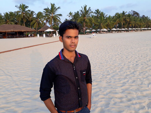 handsome young man, Young Indian men in the beach, Indian fashion, young Indian boy on the goa beach,  beach fashion. mobor beach.