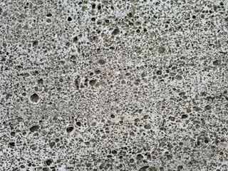 Facade with natural imperfections and holes as simple surface texture background