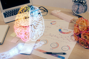 Obraz premium Double exposure of desktop with computer and brain drawing hologram. Artificial intelligence concept.