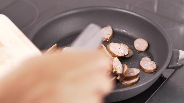 Preparing Letcho (ragout) - part 2 - frying pork sausage.