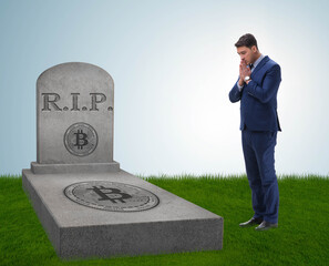 Businessman mourning the demise and death of bitcoin