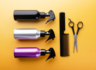 Set of hairdresser equipment: spray bottles, thinning scissors and hair comb