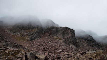 View of Mount Vioz in a foggy day with  mist and clouds (Trentino, Alps, Italy, Europe)