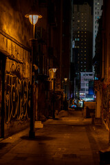 Dark alley with graffiti in Hong Kong