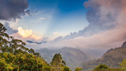 Obraz premium Bright beautiful landscape, sunset sky over the mountains.