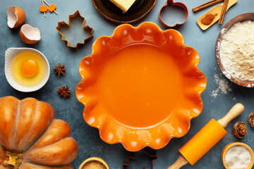 Concept homemade fall baking with pumpkin, food ingredients, spices and kitchen utencil. Cooking...