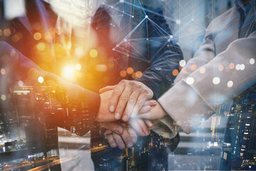 Business people putting their hands together. Concept of teamwork and partnership