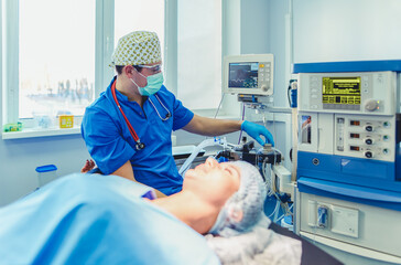 Man surgeon at work in operating room