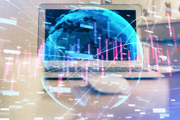 Fototapeta na wymiar Double exposure of chart and financial info and work space with computer background. Concept of international online trading.