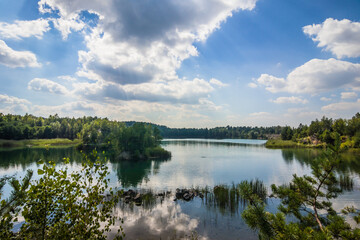 Obraz na płótnie Canvas A picturesque lake located in a former basalt quarry. Pure water and wonderful nature. Basalt Columns. Rivne oblast. Ukraine