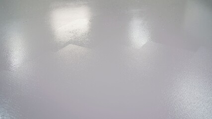 The floor is painted with white paint. Dry white paint on the concrete floor. Concrete floor painted with white paint
