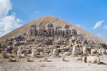 Panoramic view onto stone heads of Commagenian gods on mount Nemrut, Kahta, Turkey. Heads fell from their original bodies (they're on background) during earthquake. This place is UNESCO object