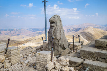 Ancient statue of Lion, near altar. Located on Eastern terrace of mount Nemrut, Kahta, Turkey,...