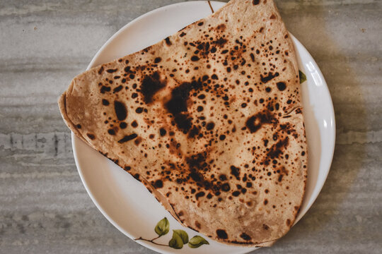Directly above shot of Indian food paratha in plate