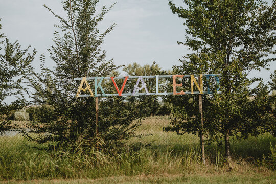 Colorful lettering Akvalend, with color letters, what means aqualand in Serbia during the sunny summer day.