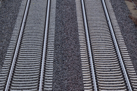 Parallel railroad tracks viewed from above. two ways.