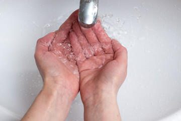 Fototapeta premium Washing hands with antibacterial soap frequently 